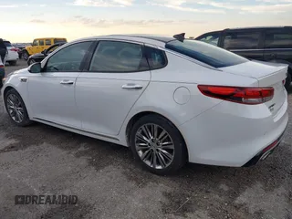 2018 Kia Optima SX z VIN 5XXGV4L21JG182103, wystawiony jako IAAI lot #40522762 z przebiegiem 60 542 mil mil oraz . Historia ofert i sprzedaży dostępna na DreamBid. Obrazek 3.
