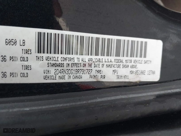 2011 Dodge Grand Caravan Mainstreet with VIN 2D4RN3DG1BR731727, listed as a IAAI auction lot 41820862 with 165,667 mi miles. Bid and sale history available at carsss.com. Image 9.