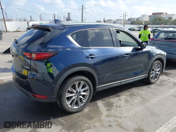 2021 Mazda CX-5 Grand Touring with VIN JM3KFBDM6M1312573, listed as a IAAI auction lot 41936739 with Not Provided miles and . Bid and sale history available at DreamBid. Image 4.