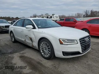 2015 Audi A8 z VIN WAUJGAFD9FN003570, wystawiony jako Copart lot #87642905 z przebiegiem 71 523 mil mil oraz Czysty tytuł • Clean title. Historia ofert i sprzedaży dostępna na DreamBid. Obrazek 4.