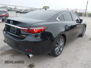 2020 Mazda 6 Grand Touring with VIN JM1GL1TY5L1513949, listed as a IAAI auction lot 40953540 with 55,616 mi miles and . Bid and sale history available at DreamBid. Image 4.