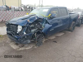 2023 Ram 1500 Laramie with VIN 1C6SRFJT9PN542437, listed as a IAAI auction lot 42256410 with 5 mi miles and . Bid and sale history available at DreamBid. Image 2.