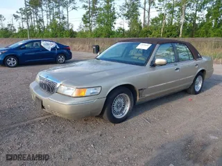 1999 Mercury Grand Marquis LS with VIN 2MEFM75W1XX703878, listed as a IAAI auction lot 42074187 with 56,962 mi miles. Bid and sale history available at carsss.com. Image 2.