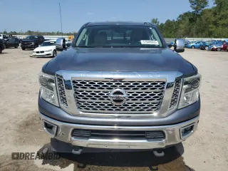 2017 Nissan Titan SL z VIN 1N6BA1F49HN514463, wystawiony jako Copart lot #51046805 z przebiegiem 99 686 mil mil oraz Szkody całkowita. Historia ofert i sprzedaży dostępna na DreamBid. Obrazek 5.