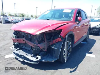 2016 Mazda CX-5 Grand Touring z VIN JM3KE2DY2G0660385, wystawiony jako IAAI lot #42101004 z przebiegiem 166 336 mil mil oraz . Historia ofert i sprzedaży dostępna na DreamBid. Obrazek 18.