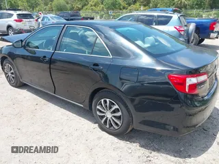 2014 Toyota Camry L with VIN 4T4BF1FKXER402857, listed as a IAAI auction lot 42144757 with 192,081 mi miles and . Bid and sale history available at DreamBid. Image 3.