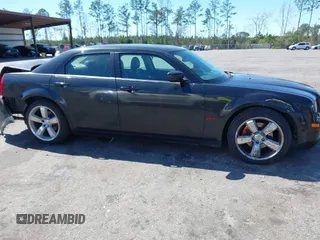 2005 Chrysler 300 with VIN 2C3AA63HX5H649107, listed as a IAAI auction lot 41748562 with 173,803 mi miles. Bid and sale history available at carsss.com. Image 13.