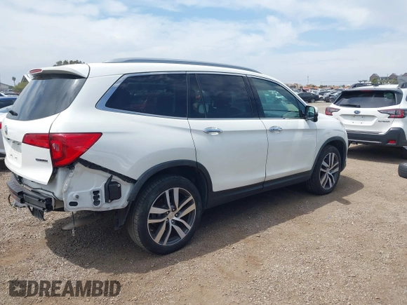 2017 Honda Pilot Touring with VIN 5FNYF5H95HB042632, listed as a IAAI auction lot 42011885 with 103,321 mi miles. Bid and sale history available at carsss.com. Image 4.