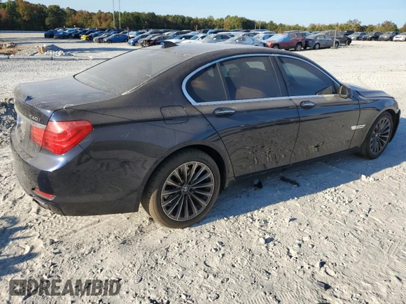 2011 BMW 7 Series 740i with VIN WBAKA4C51BC612629, listed as a Copart auction lot 77372234 with 164,471 mi miles and Salvage Title. Bid and sale history available at carsss.com. Image 3.