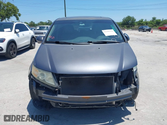 2014 Honda Odyssey EX-L z VIN 5FNRL5H69EB095297, wystawiony jako IAAI lot #42299438 z przebiegiem 126 841 mil mil oraz . Historia ofert i sprzedaży dostępna na DreamBid. Obrazek 13.