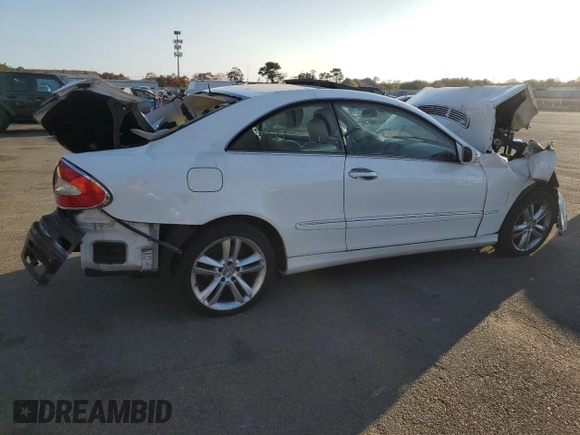 2006 Mercedes-Benz CLK-Class 3.5L with VIN WDBTJ56J76F171100, listed as a Copart auction lot 77068234 with 86,635 mi miles and Salvage Title. Bid and sale history available at carsss.com. Image 3.