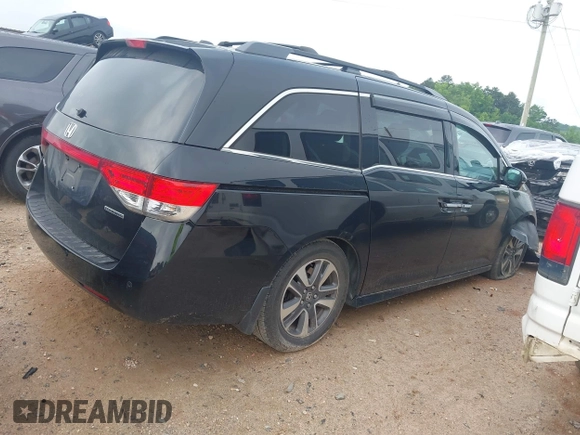 2015 Honda Odyssey Touring Elite with VIN 5FNRL5H90FB065004, listed as a IAAI auction lot 42461597 with 317,523 mi miles and . Bid and sale history available at DreamBid. Image 13.