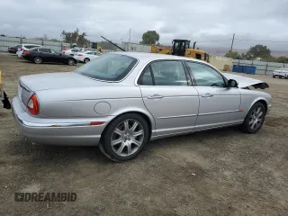 2004 Jaguar XJ with VIN SAJEA74C34SG09548, listed as a Copart auction lot 71754774 with 142,804 mi miles and Salvage Title. Bid and sale history available at DreamBid. Image 3.