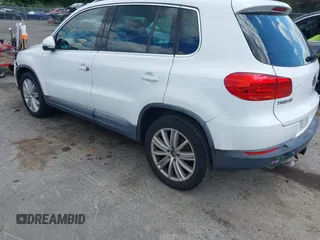 2012 Volkswagen Tiguan S with VIN WVGAV7AX0CW566151, listed as a IAAI auction lot 42826985 with 121,185 mi miles and . Bid and sale history available at DreamBid. Image 3.