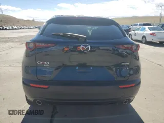 2023 Mazda CX-30 S Carbon Edition z VIN 3MVDMBCM3PM554378, wystawiony jako Copart lot #50558075 z przebiegiem 26 658 mil mil oraz Szkoda całkowita • Salvage title. Historia ofert i sprzedaży dostępna na DreamBid. Obrazek 6.
