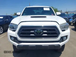 2021 Toyota Tacoma 4WD SR5 with VIN 3TMDZ5BN4MM106693, listed as a IAAI auction lot 41986838 with 52,510 mi miles. Bid and sale history available at carsss.com. Image 12.