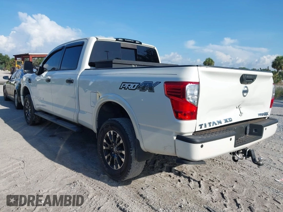 2016 Nissan Titan Platinum Reserve with VIN 1N6BA1F4XGN517905, listed as a IAAI auction lot 42676671 with 110,004 mi miles and . Bid and sale history available at DreamBid. Image 3.
