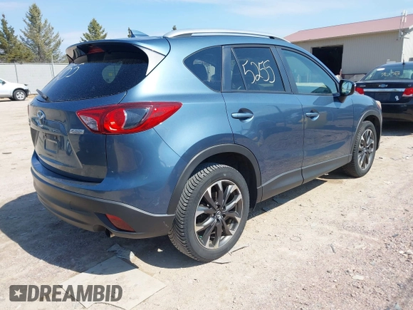 2016 Mazda CX-5 Grand Touring z VIN JM3KE4DY6G0785255, wystawiony jako IAAI lot #41887066 z przebiegiem 171 334 mil mil oraz . Historia ofert i sprzedaży dostępna na DreamBid. Obrazek 4.