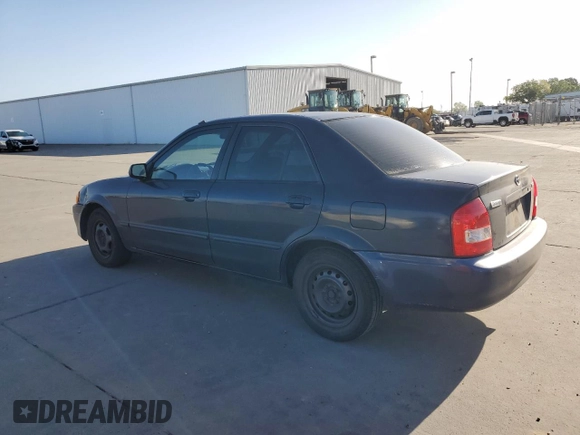 1999 Mazda Protege DX z VIN JM1BJ2227X0106522, wystawiony jako Copart lot #52423565 z przebiegiem 206 260 mil mil oraz Szkoda całkowita • Salvage title. Historia ofert i sprzedaży dostępna na DreamBid. Obrazek 2.