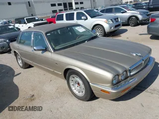 1999 Jaguar XJ with VIN SAJKD6047XC867859, listed as a IAAI auction lot 42799148 with 113,083 mi miles and . Bid and sale history available at DreamBid. Image 1.