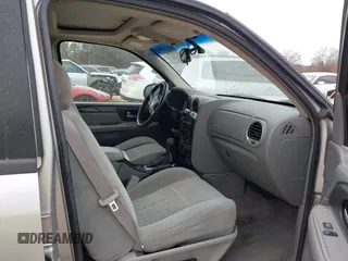 2005 GMC Envoy SLT with VIN 1GKDT13S452263166, listed as a IAAI auction lot 41543466 with 166,999 mi miles. Bid and sale history available at carsss.com. Image 5.