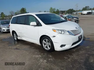 2015 Toyota Sienna LE AAS with VIN 5TDKK3DC2FS590667, listed as a IAAI auction lot 41997673 with 169,828 mi miles. Bid and sale history available at carsss.com. Image 1.
