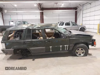 1997 Jeep Grand Cherokee Laredo z VIN 1J4GZ58YXVC729117, wystawiony jako IAAI lot #42244799 z przebiegiem Nie podano mil oraz . Historia ofert i sprzedaży dostępna na DreamBid. Obrazek 14.
