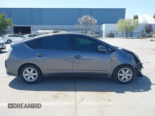 2007 Toyota Prius z VIN JTDKB20U273215633, wystawiony jako IAAI lot #41955538 z przebiegiem 172 957 mil mil oraz . Historia ofert i sprzedaży dostępna na DreamBid. Obrazek 13.