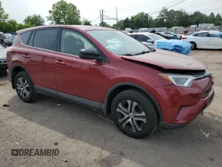 2018 Toyota RAV4 LE with VIN JTMBFREV2JD233808, listed as a Copart auction lot 59021235 with 71,430 mi miles and Salvage title. Bid and sale history available at DreamBid. Image 4.
