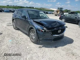 2021 Mazda CX-5 Grand Touring with VIN JM3KFADM1M0301366, listed as a Copart auction lot 52890955 with 66,686 mi miles and Non Repairable. Bid and sale history available at carsss.com. Image 12.