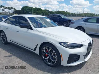 2024 BMW i4 eDrive35 with VIN WBY43AW02RFS79370, listed as a IAAI auction lot 41887964 with 11,910 mi miles. Bid and sale history available at carsss.com. Image 1.