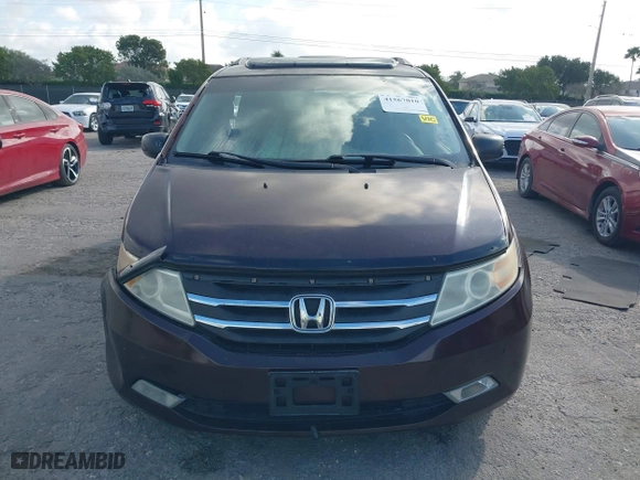 2011 Honda Odyssey Touring with VIN 5FNRL5H97BB008759, listed as a IAAI auction lot 41567010 with 215,709 mi miles. Bid and sale history available at carsss.com. Image 12.