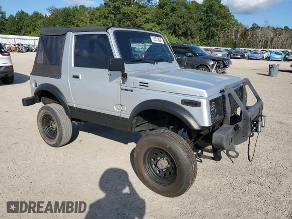 1987 Suzuki Samurai z VIN JS3JC51C3H4186141, wystawiony jako Copart lot #72551804 z przebiegiem 525 030 mil mil oraz Szkoda całkowita • Salvage title. Historia ofert i sprzedaży dostępna na DreamBid. Obrazek 4.