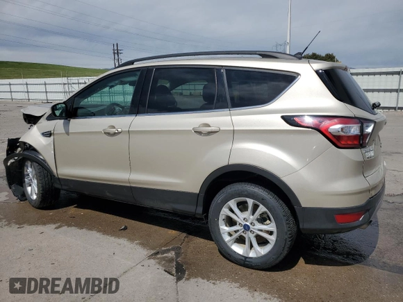 2018 Ford Escape SE z VIN 1FMCU9GD5JUC08024, wystawiony jako Copart lot #56531105 z przebiegiem 54 104 mil mil oraz Szkoda całkowita • Salvage title. Historia ofert i sprzedaży dostępna na DreamBid. Obrazek 2.