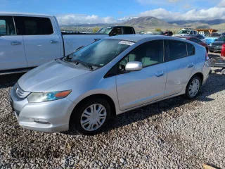 2010 Honda Insight LX with VIN JHMZE2H51AS011243, listed as a Copart auction lot 54445555 with 224,722 mi miles and Salvage Title. Bid and sale history available at DreamBid. Image 1.