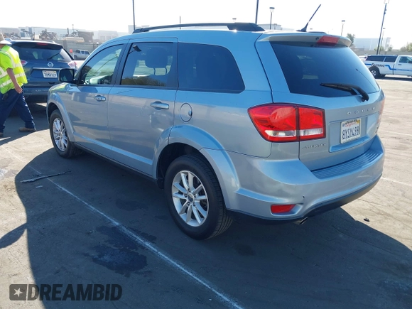 2013 Dodge Journey SXT with VIN 3C4PDCBG5DT674863, listed as a IAAI auction lot 41670225 with 207,524 mi miles. Bid and sale history available at carsss.com. Image 3.