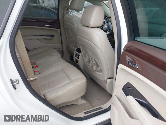 2014 Cadillac SRX Performance Collection with VIN 3GYFNCE34ES519059, listed as a IAAI auction lot 42237351 with 80,578 mi miles and . Bid and sale history available at DreamBid. Image 8.