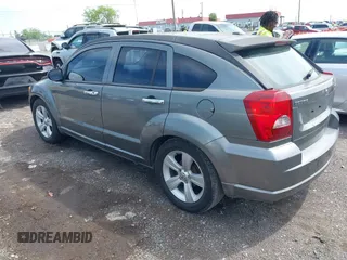 2011 Dodge Caliber Mainstreet with VIN 1B3CB3HA1BD247594, listed as a IAAI auction lot 42082305 with 122,438 mi miles. Bid and sale history available at carsss.com. Image 3.