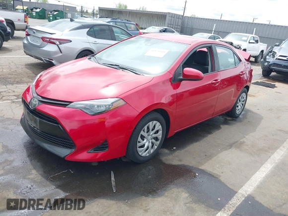 2019 Toyota Corolla L with VIN 5YFBURHE4KP883871, listed as a IAAI auction lot 41979494 with 179,078 mi miles. Bid and sale history available at carsss.com. Image 2.
