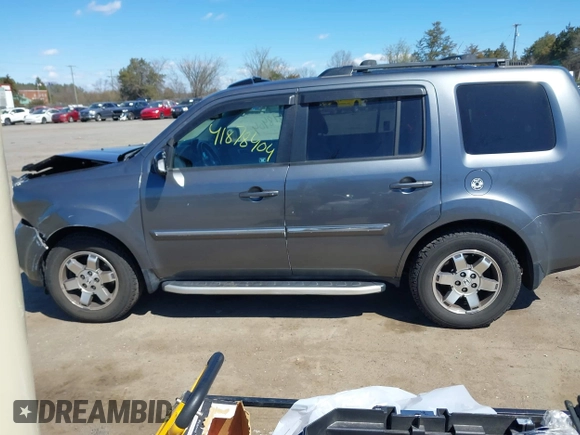 2011 Honda Pilot Touring with VIN 5FNYF4H95BB090892, listed as a IAAI auction lot 41878404 with 131,757 mi miles. Bid and sale history available at carsss.com. Image 14.
