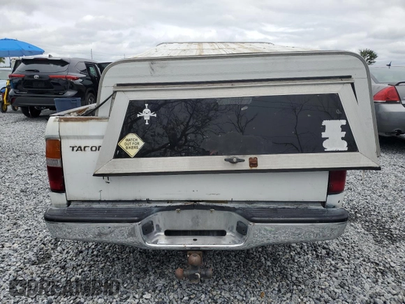 1999 Toyota Tacoma z VIN 4TAVL52N8XZ435689, wystawiony jako Copart lot #52162105 z przebiegiem 2 317 301 mil mil oraz Szkoda całkowita • Salvage title. Historia ofert i sprzedaży dostępna na DreamBid. Obrazek 6.