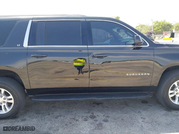 2018 Chevrolet Suburban LT with VIN 1GNSCHKC7JR111560, listed as a IAAI auction lot 41823175 with 136,751 mi miles. Bid and sale history available at carsss.com. Image 6.
