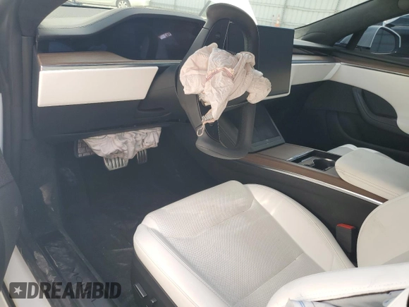2022 Tesla Model S z VIN 5YJSA1E57NF474679, wystawiony jako Copart lot #56608285 z przebiegiem Nie podano mil oraz Szkoda całkowita • Salvage title. Historia ofert i sprzedaży dostępna na DreamBid. Obrazek 8.