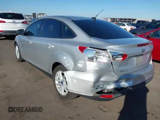 2018 Ford Focus SE z VIN 1FADP3F27JL204873, wystawiony jako IAAI lot #41657504 z przebiegiem 99 224 mil mil oraz . Historia ofert i sprzedaży dostępna na DreamBid. Obrazek 3.