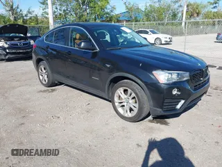 2016 BMW X4 xDrive28i with VIN 5UXXW3C51G0M89975, listed as a IAAI auction lot 41753869 with 93,351 mi miles. Bid and sale history available at carsss.com. Image 1.