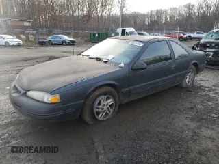 1996 Ford Thunderbird LX z VIN 1FALP6248TH116814, wystawiony jako Copart lot #86814464 z przebiegiem 107 427 mil mil oraz Szkoda całkowita • Salvage title. Historia ofert i sprzedaży dostępna na DreamBid. Obrazek 1.