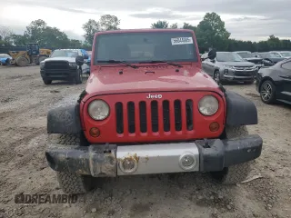 2012 Jeep Wrangler Unlimited Sport z VIN 1C4BJWDG0CL272440, wystawiony jako Copart lot #56044005 z przebiegiem 143 117 mil mil oraz Szkoda całkowita • Salvage title. Historia ofert i sprzedaży dostępna na DreamBid. Obrazek 5.