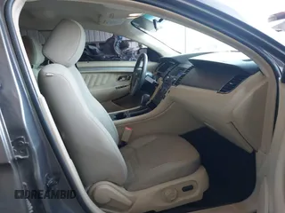 2014 Ford Taurus SE with VIN 1FAHP2D89EG136335, listed as a IAAI auction lot 41880655 with 211,635 mi miles. Bid and sale history available at carsss.com. Image 5.