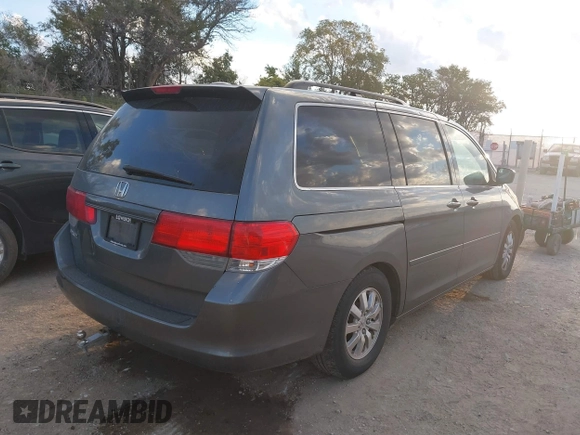 2010 Honda Odyssey EX-L with VIN 5FNRL3H70AB074913, listed as a IAAI auction lot 40142162 with 210,771 mi miles and . Bid and sale history available at DreamBid. Image 4.