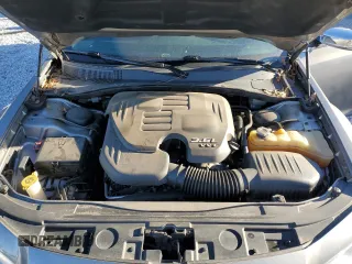 2014 Chrysler 300 C z VIN 2C3CCAEG9EH328699, wystawiony jako Copart lot #88137275 z przebiegiem 132 555 mil mil oraz Szkoda całkowita • Salvage title. Historia ofert i sprzedaży dostępna na DreamBid. Obrazek 11.